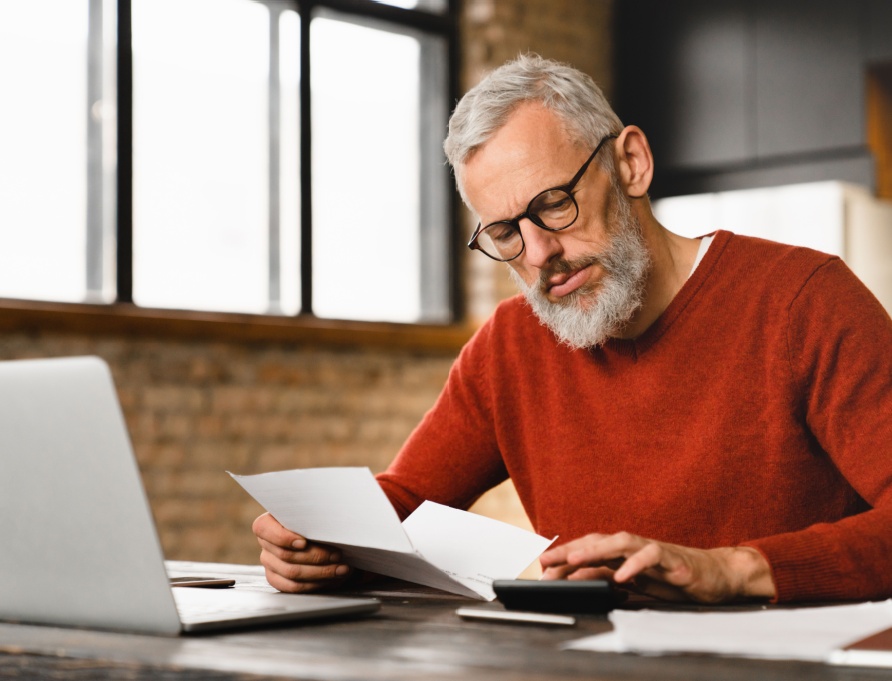 A man reading some paperwork.