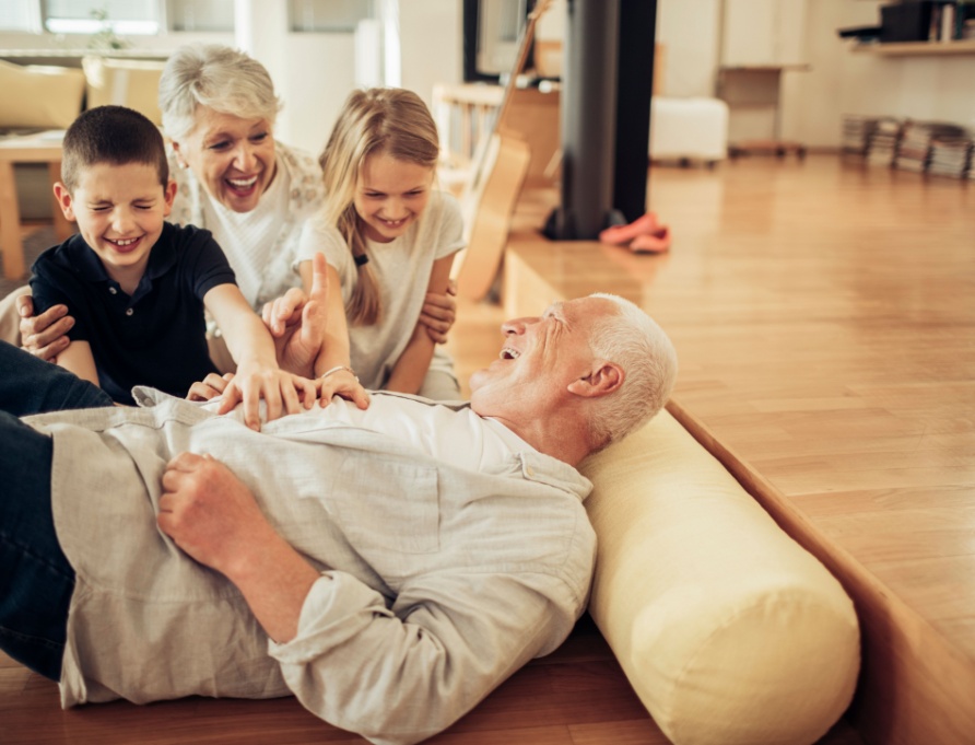 Grandparents playing with their grandchildren.