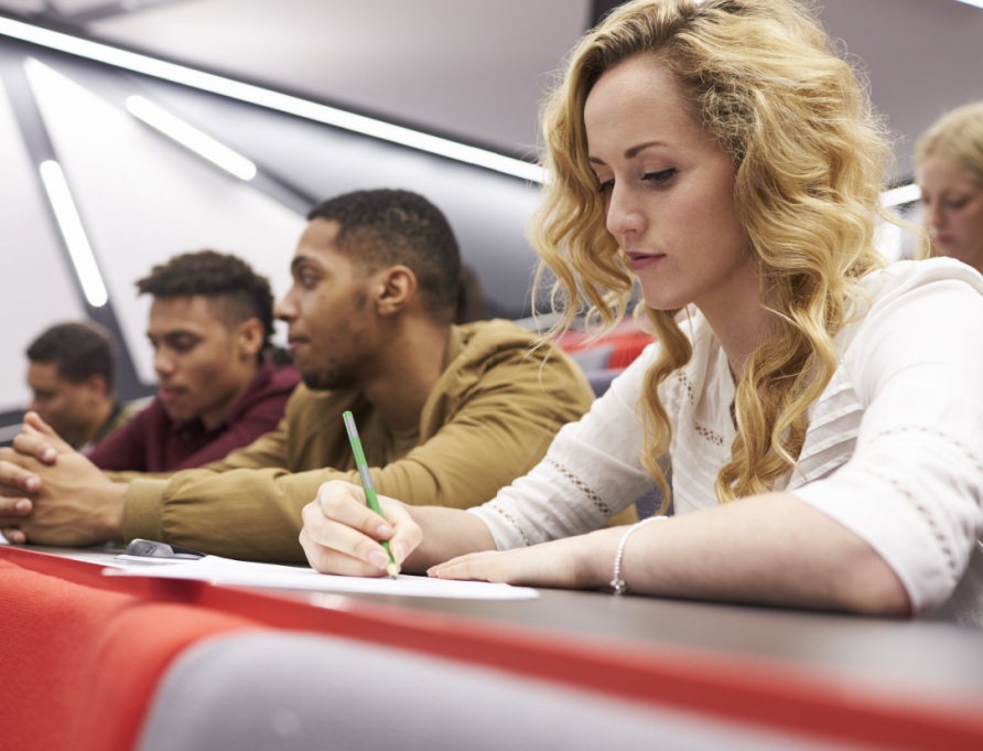A group of students in a university lecture hall.