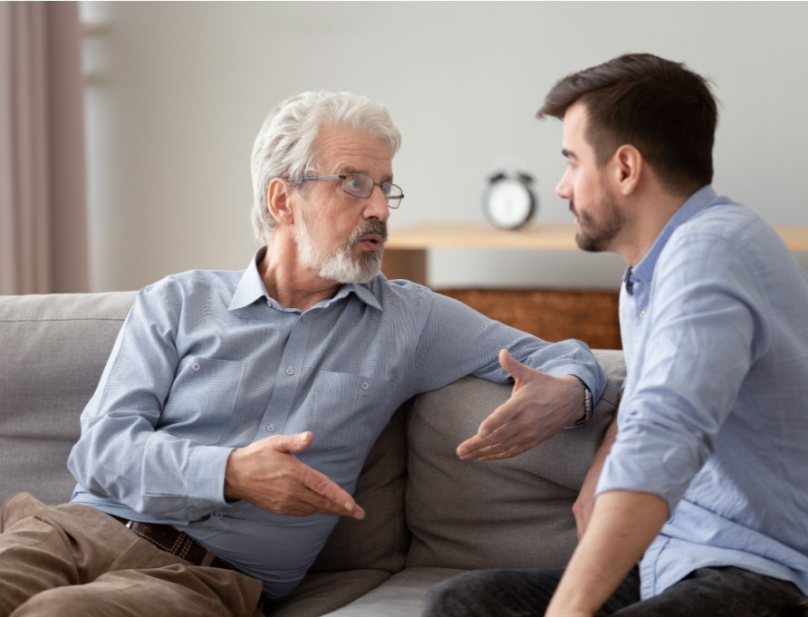 A father and son having a serious conversation.