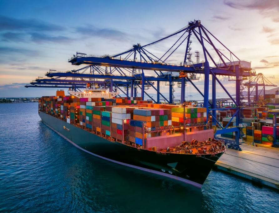 A container cargo ship at a commercial dock.
