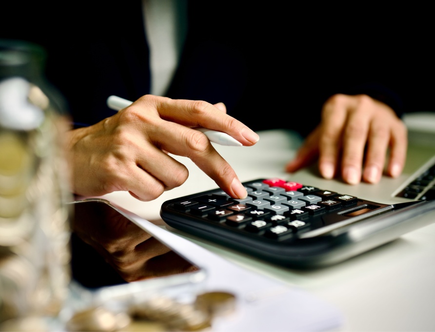 A person using a calculator.