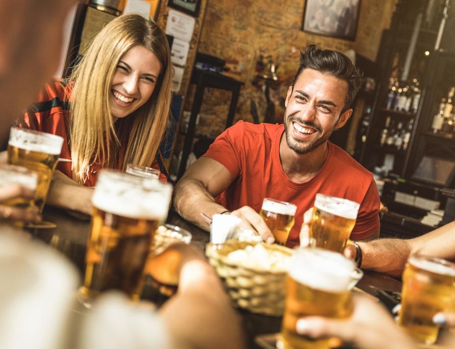 Friends having a drink in the pub.