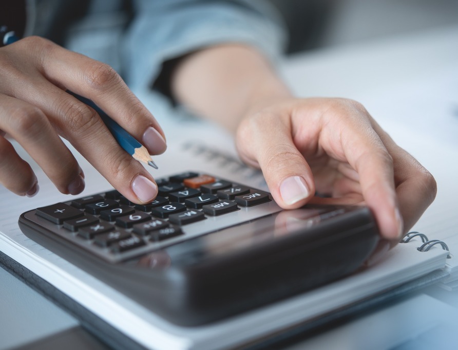 A person using a calculator.