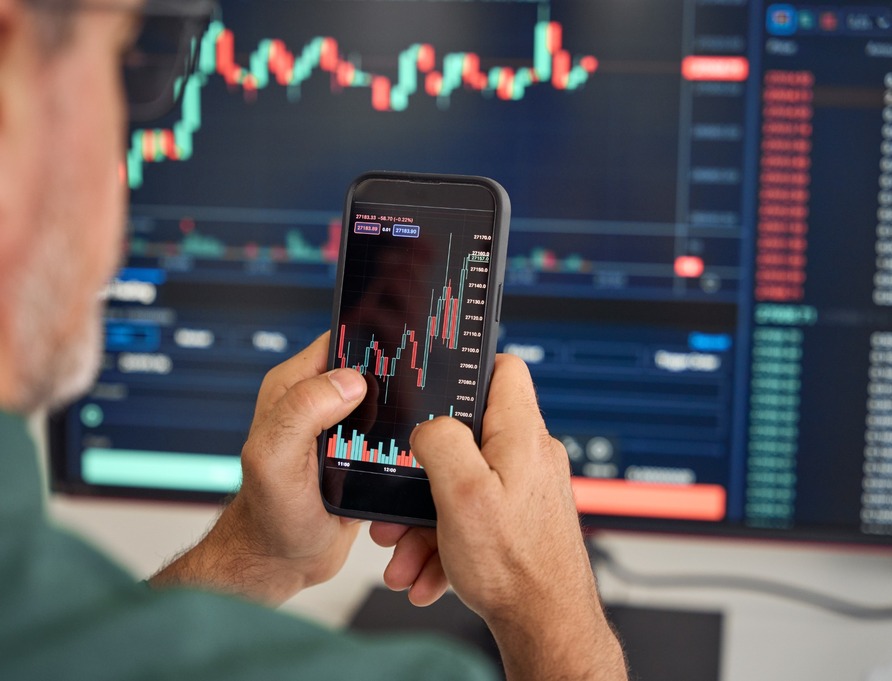 An investor reviewing performance on a phone.
