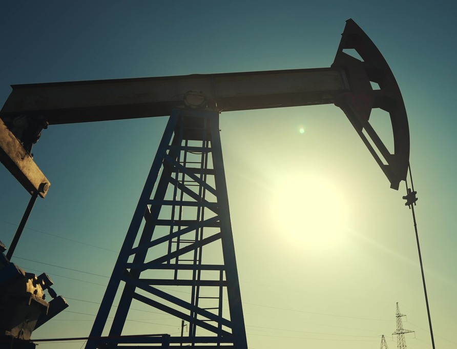 A silhouette of an oil pump.